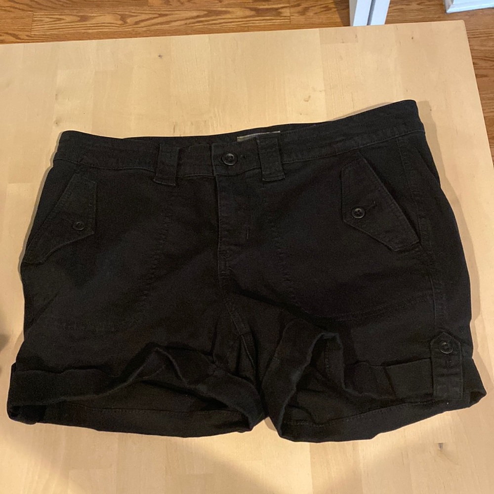 Black (not faded) shorts with cute button folds.
